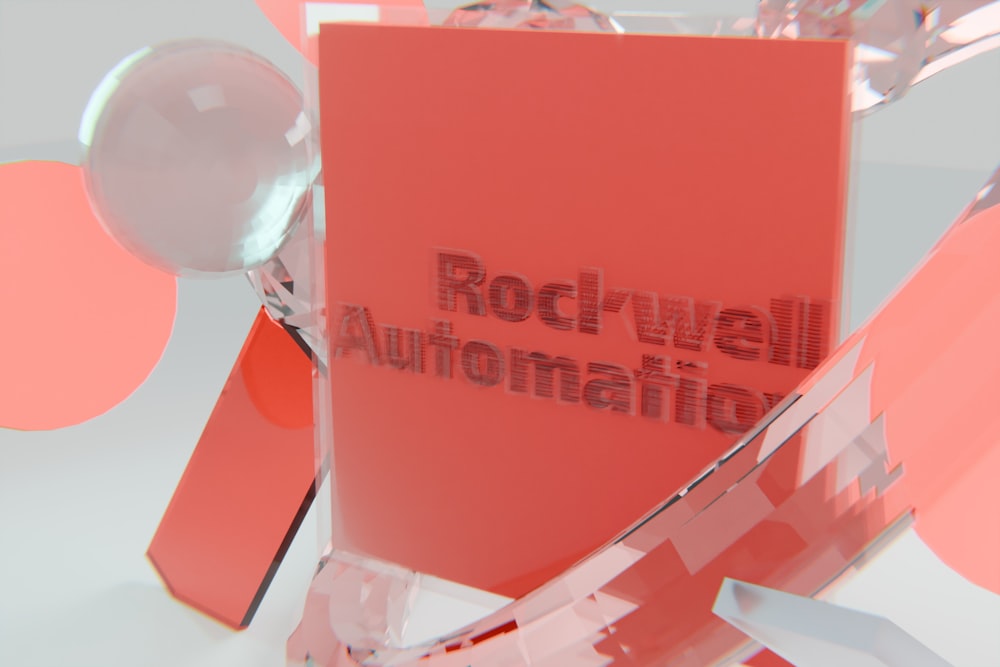 Red rectangular block with text surrounded by abstract glass shapes