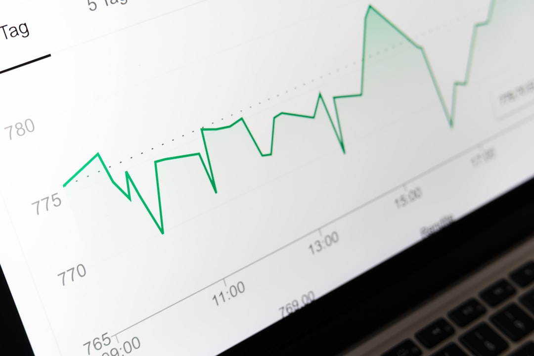 Close-up of a laptop screen showing a green line chart across an hourly axis